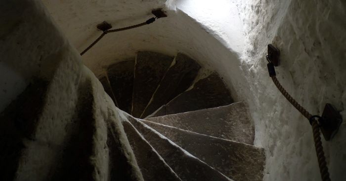 Narrow defensive stairs at Cahir Castle, County Tipperary, Ireland.